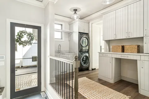 a view of an entryway with wooden floor and stairs