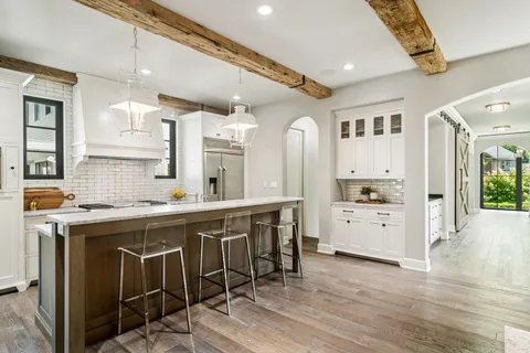 a kitchen with a stove and a sink
