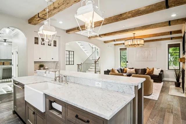 a kitchen with a sink appliances and cabinets
