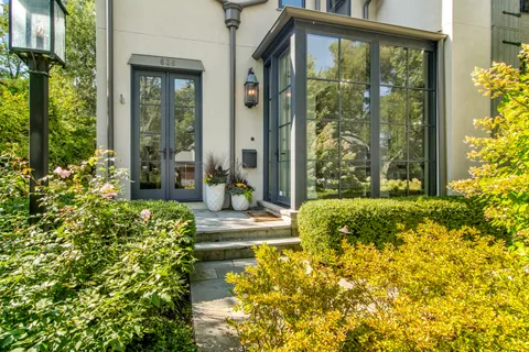 a front view of a house with garden