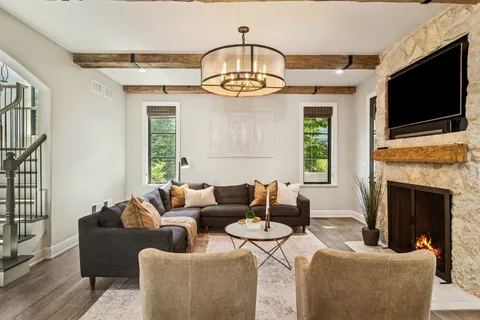 a living room with furniture and a large window