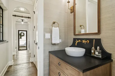 a spacious bathroom with a sink and a mirror