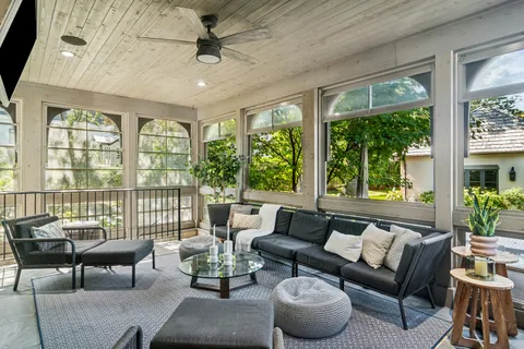 a bathroom with a tub shower and sink
