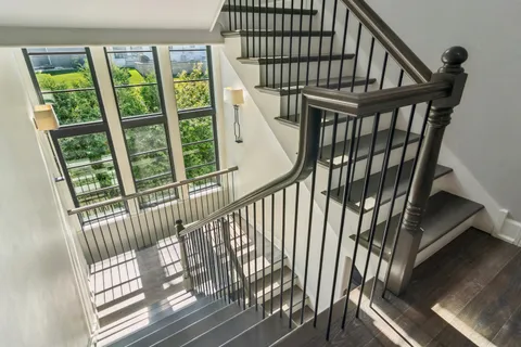 a spacious bedroom with a bed and a window