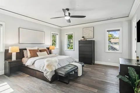 a bedroom with a bed a couch and a window