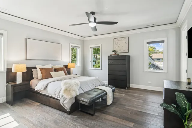 a bedroom with a bed a couch and a window