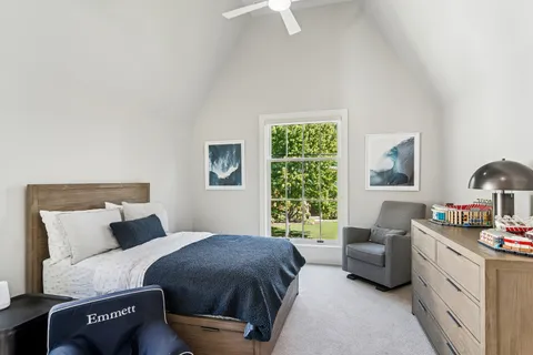 a view of a room with wooden floor and windows