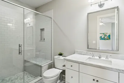 a kitchen with a sink and wooden floor