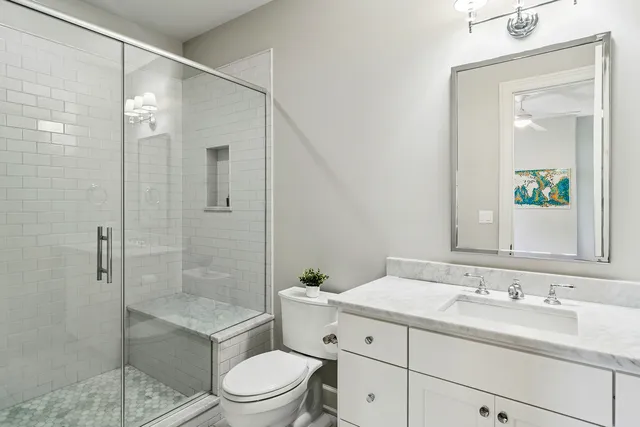 a kitchen with a sink and wooden floor