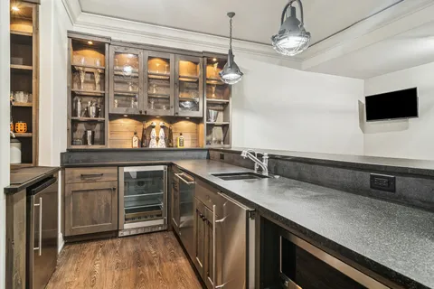 a view of an house with backyard and sitting area