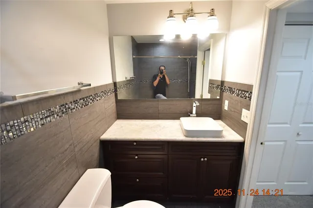 a bathroom with a sink and mirror