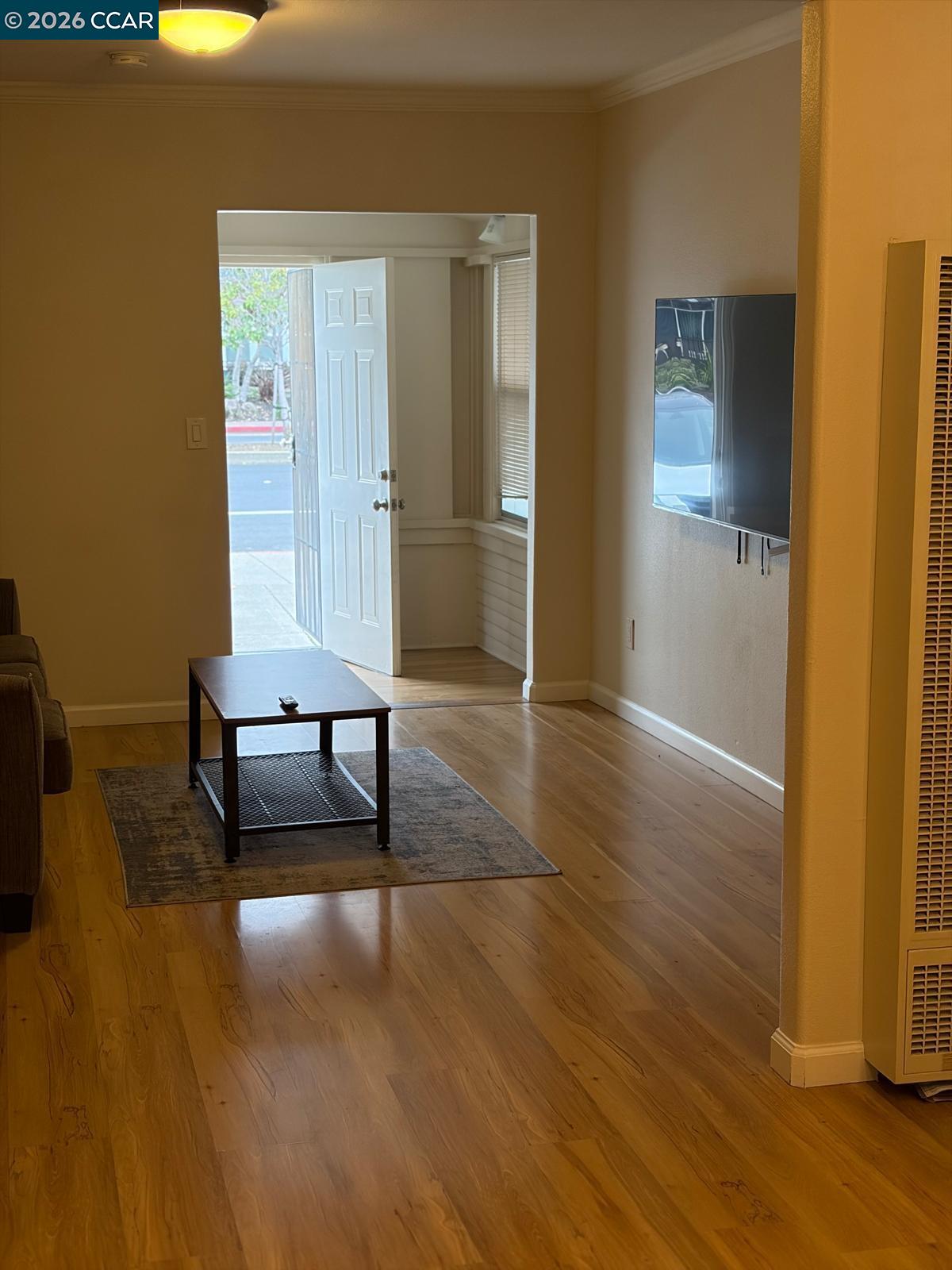 558 A Street Hayward, CA 94541 - Photo 3 of 9 a living room with furniture and a wooden floor