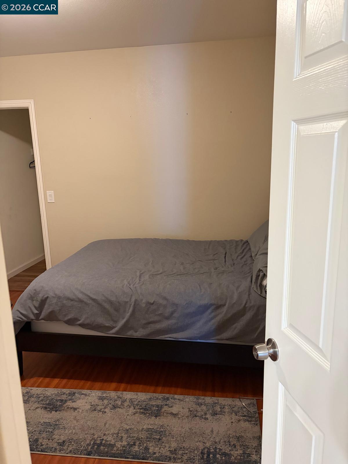 558 A Street Hayward, CA 94541 - Photo 5 of 9 a living room with a bed