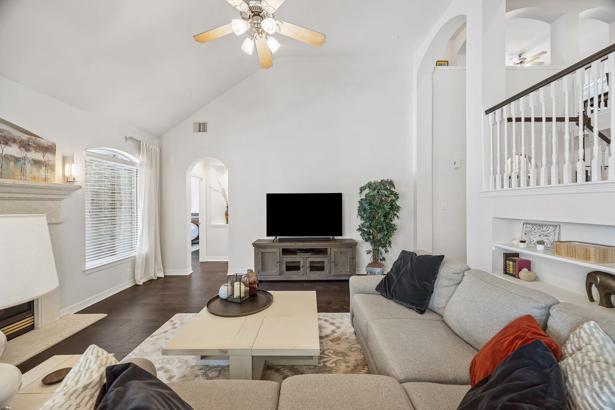 5718 Brennan Ridge Lane Katy, TX 77450 - Photo 9 of 42 DESIGNED FOR CONNECTION: Artisan hand-scraped wood floors flow seamlessly throughout the main living spaces, creating effortless transitions between the family room, kitchen, dining room, and entryway.