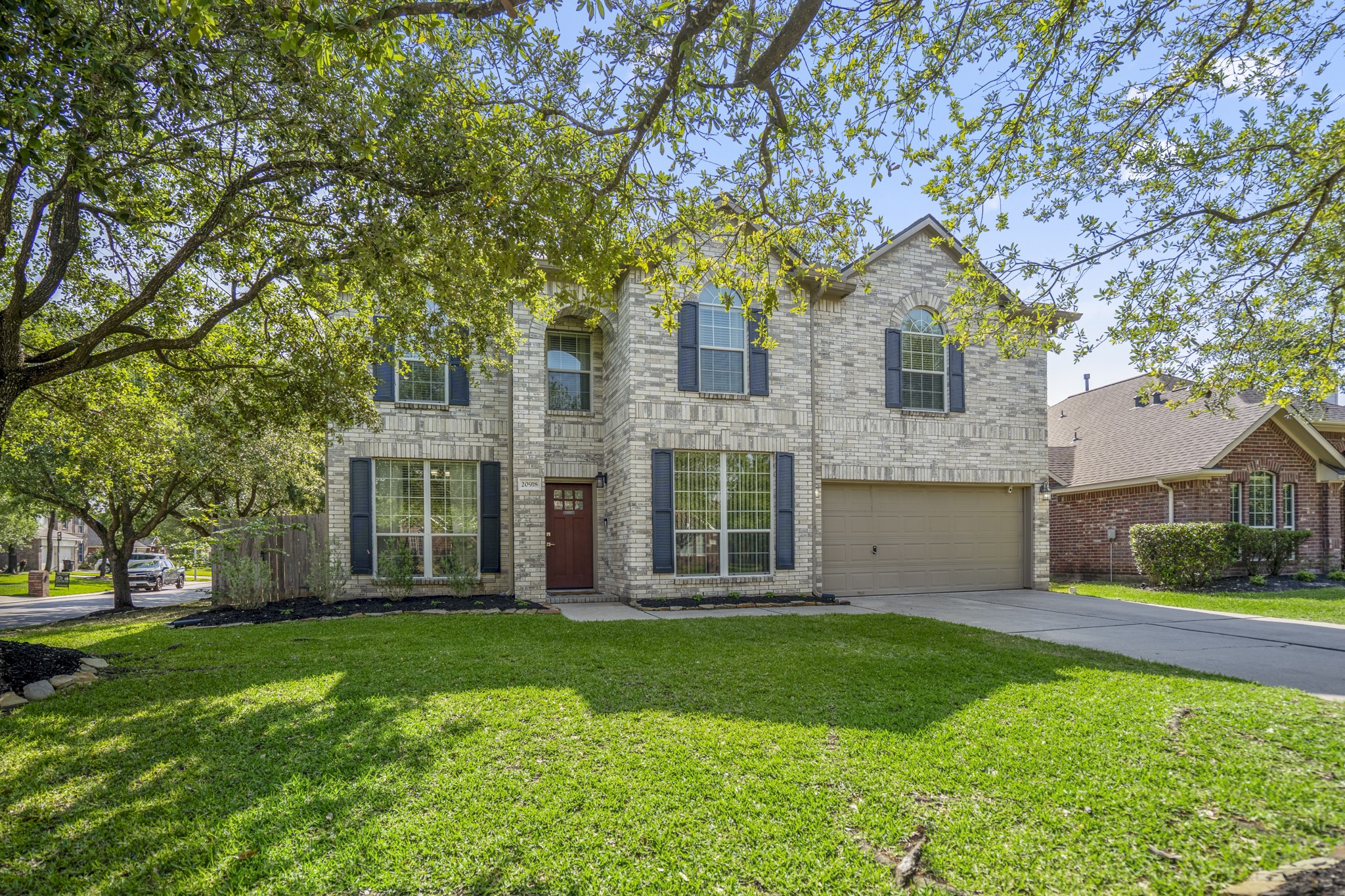 Set on a quiet corner lot with mature trees and no through traffic, this two-story home makes a welcoming first impression before you even step inside.