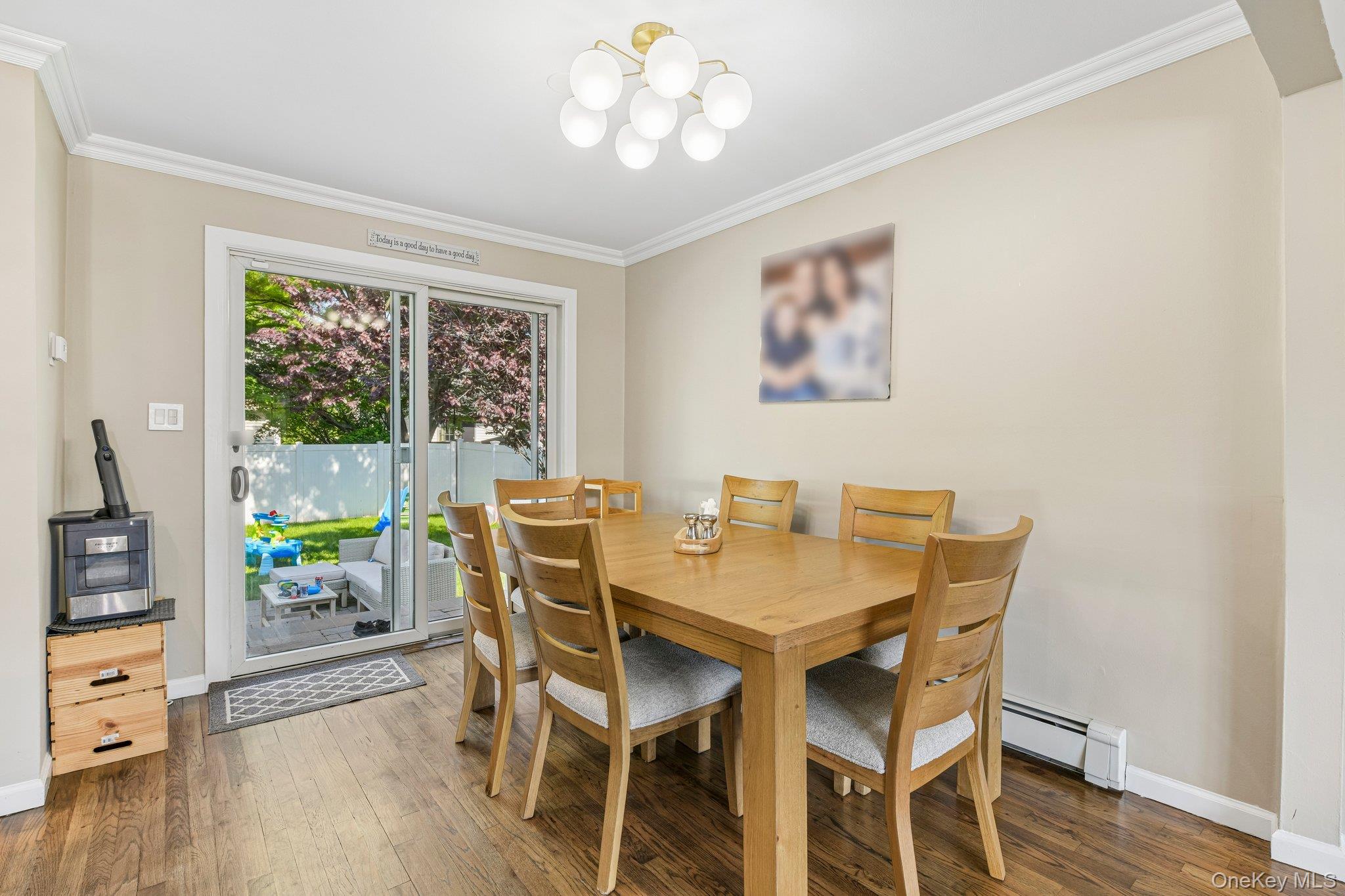 2821 Colonial Avenue Merrick, NY 11566 - Photo 7 of 29 a view of a dining room with furniture window and wooden floor