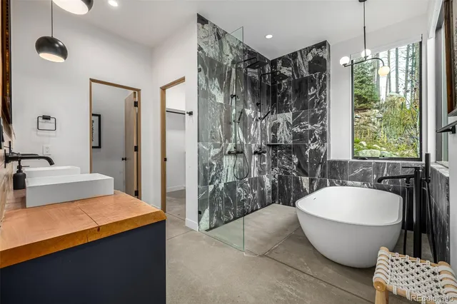 a bathroom with a sink mirror and vanity
