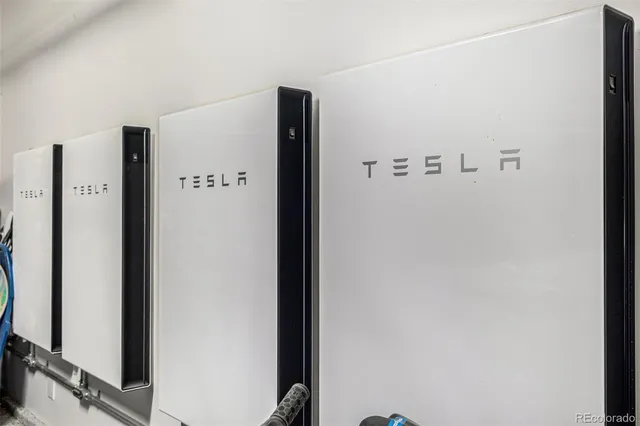 a view of a patio with iron fence