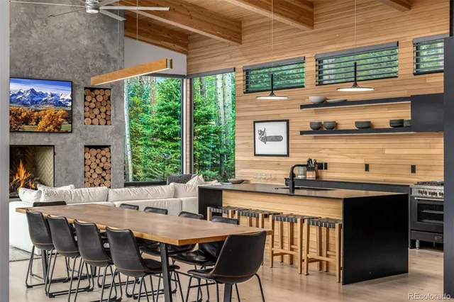a view of a dining room with furniture window and outside view