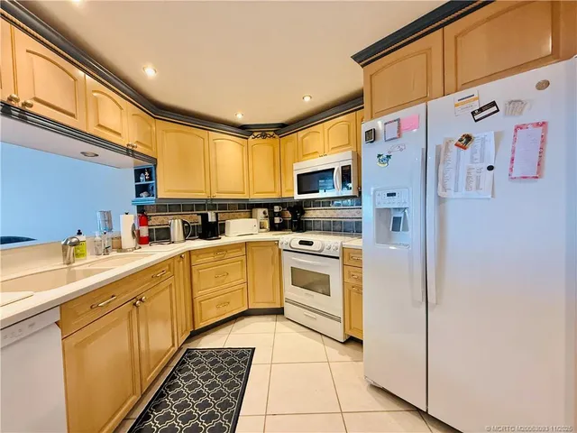 a bed room with a bed and a chair