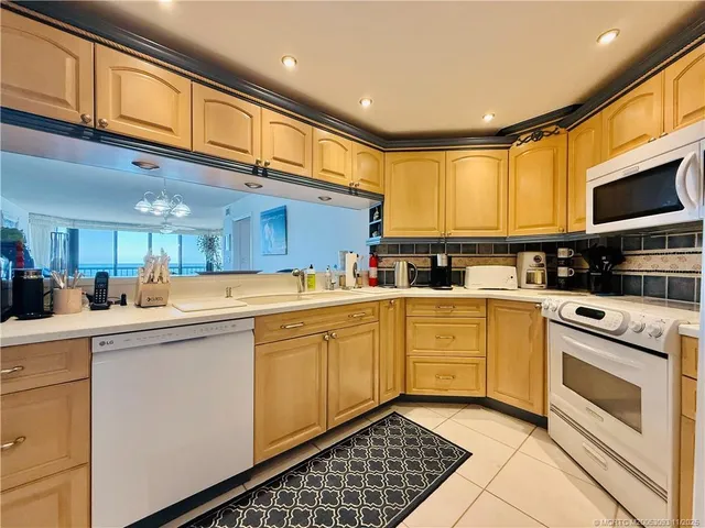 a bed sitting in a bedroom next to a lamp