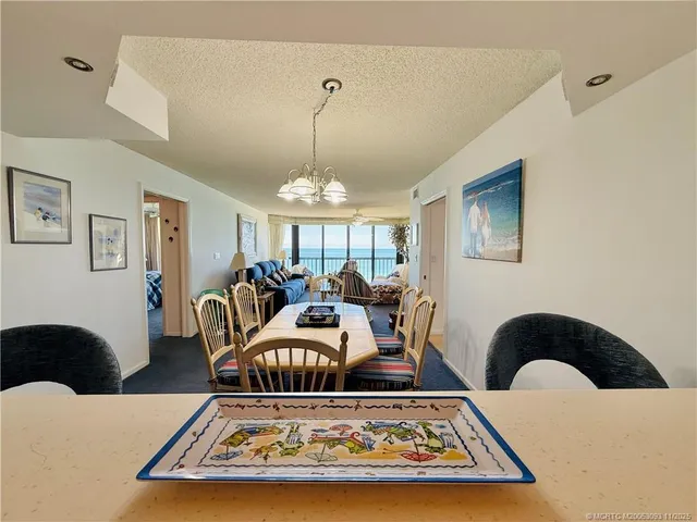 a bedroom with bed and white cabinets