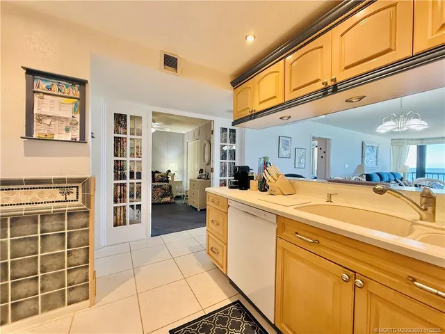 a bathroom with a granite countertop sink toilet mirror and shower