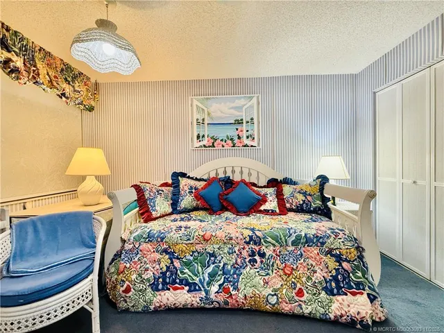 a view of a hallway with a livingroom and couch