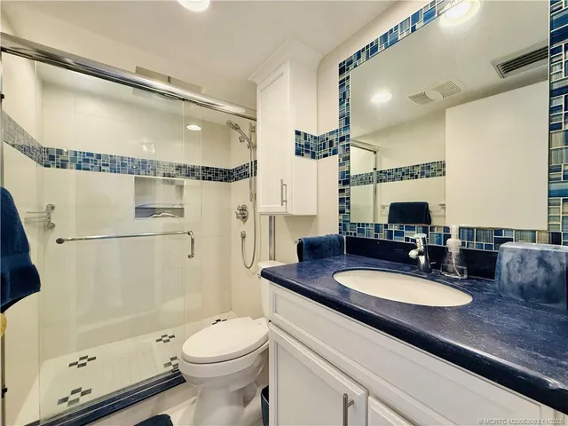 a view of balcony with wooden floor