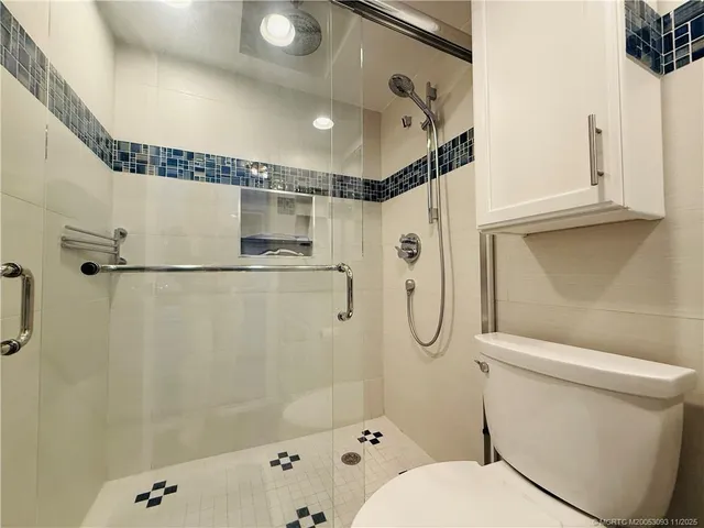 a bedroom with double bed and a large window