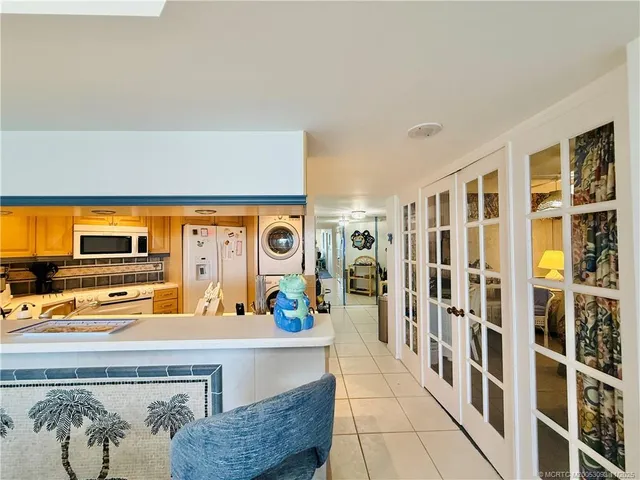 a spacious bedroom with a large bed and a flat screen tv