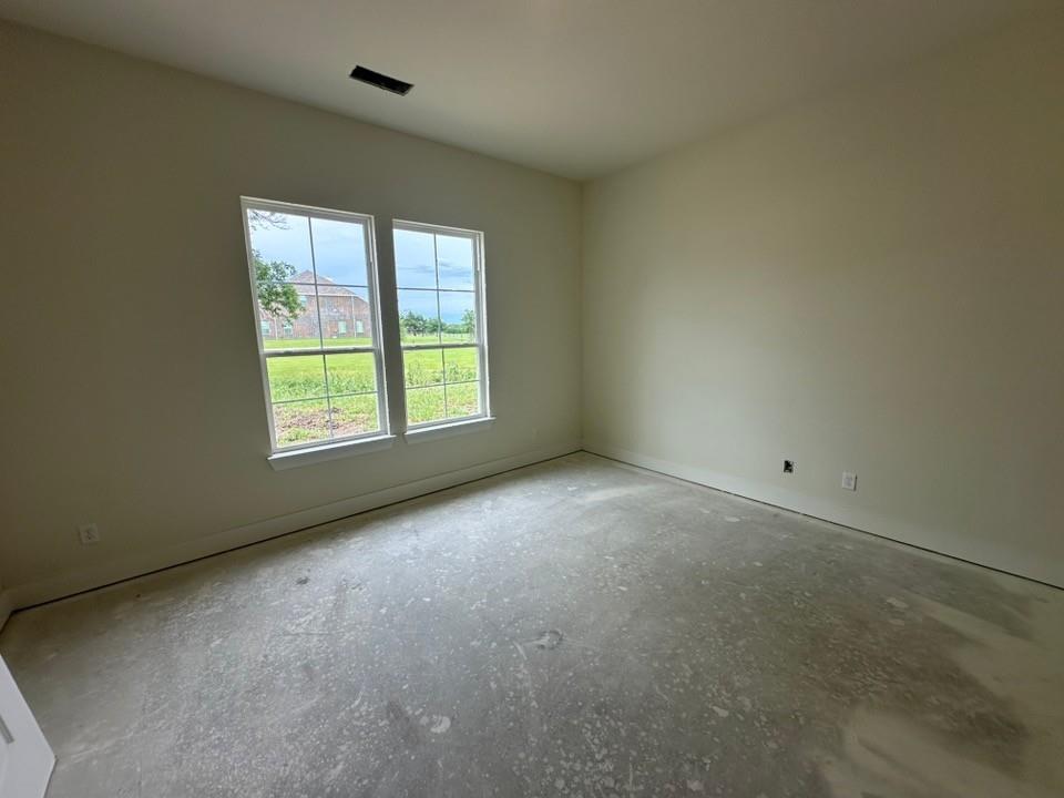 205 Cobb Road Leonard, TX 75452 - Photo 7 of 28 Interior room with dual windows, beige wall paint, white trim, and a ceiling air vent