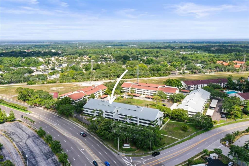2579 Countryside Boulevard, Unit 203 Clearwater, FL 33761 - Photo 14 of 37 an aerial view of a house with a garden