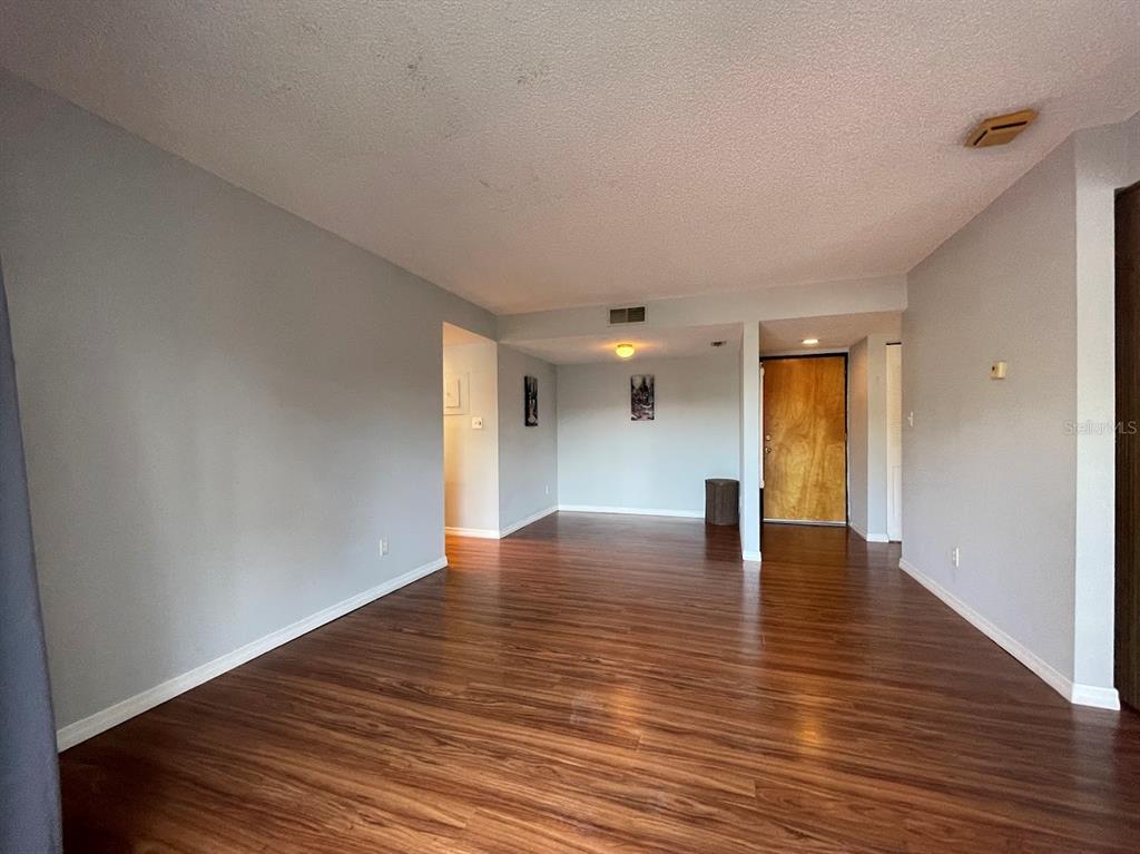 2579 Countryside Boulevard, Unit 203 Clearwater, FL 33761 - Photo 26 of 37 a view of empty room with wooden floor