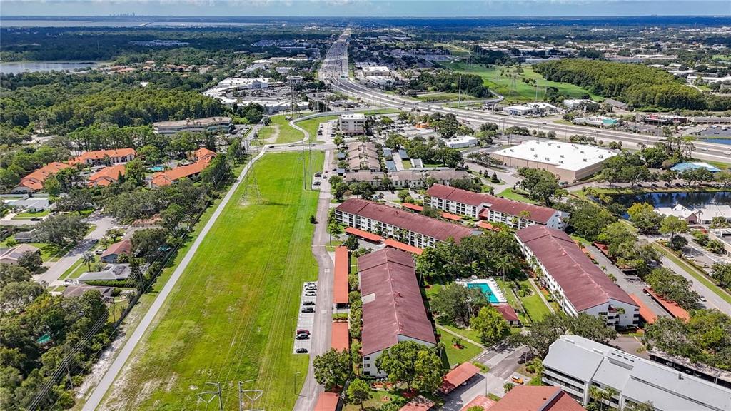 2579 Countryside Boulevard, Unit 203 Clearwater, FL 33761 - Photo 8 of 37 an aerial view of residential houses with outdoor space