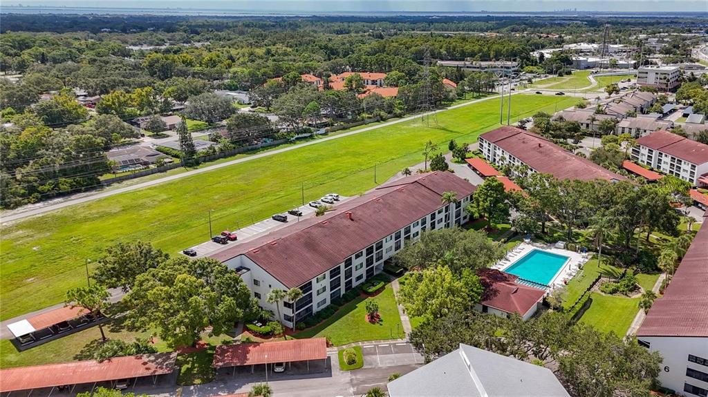 2579 Countryside Boulevard, Unit 203 Clearwater, FL 33761 - Photo 9 of 37 an aerial view of a house with a swimming pool yard and outdoor seating