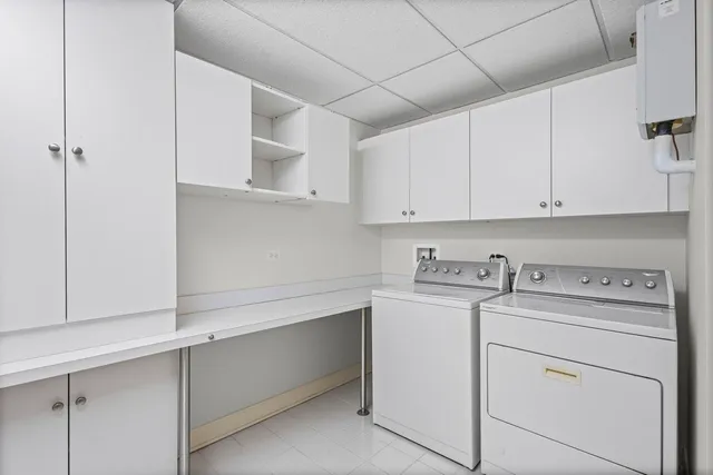a view of cabinets a sink and dishwasher in a kitchen