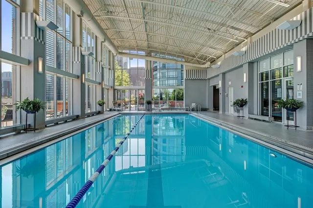 a view of swimming pool with outdoor seating