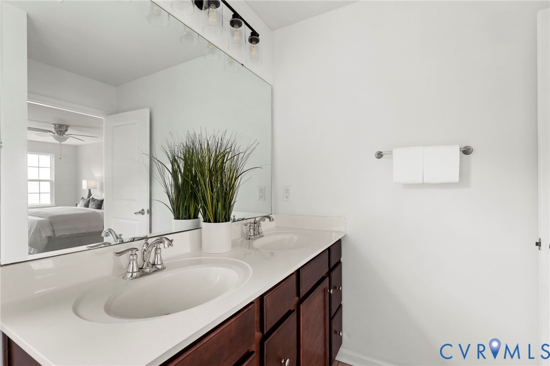 5313 Sandy Ridge Court Chesterfield, VA 23832 - Photo 20 of 28 a bathroom with a sink and a mirror