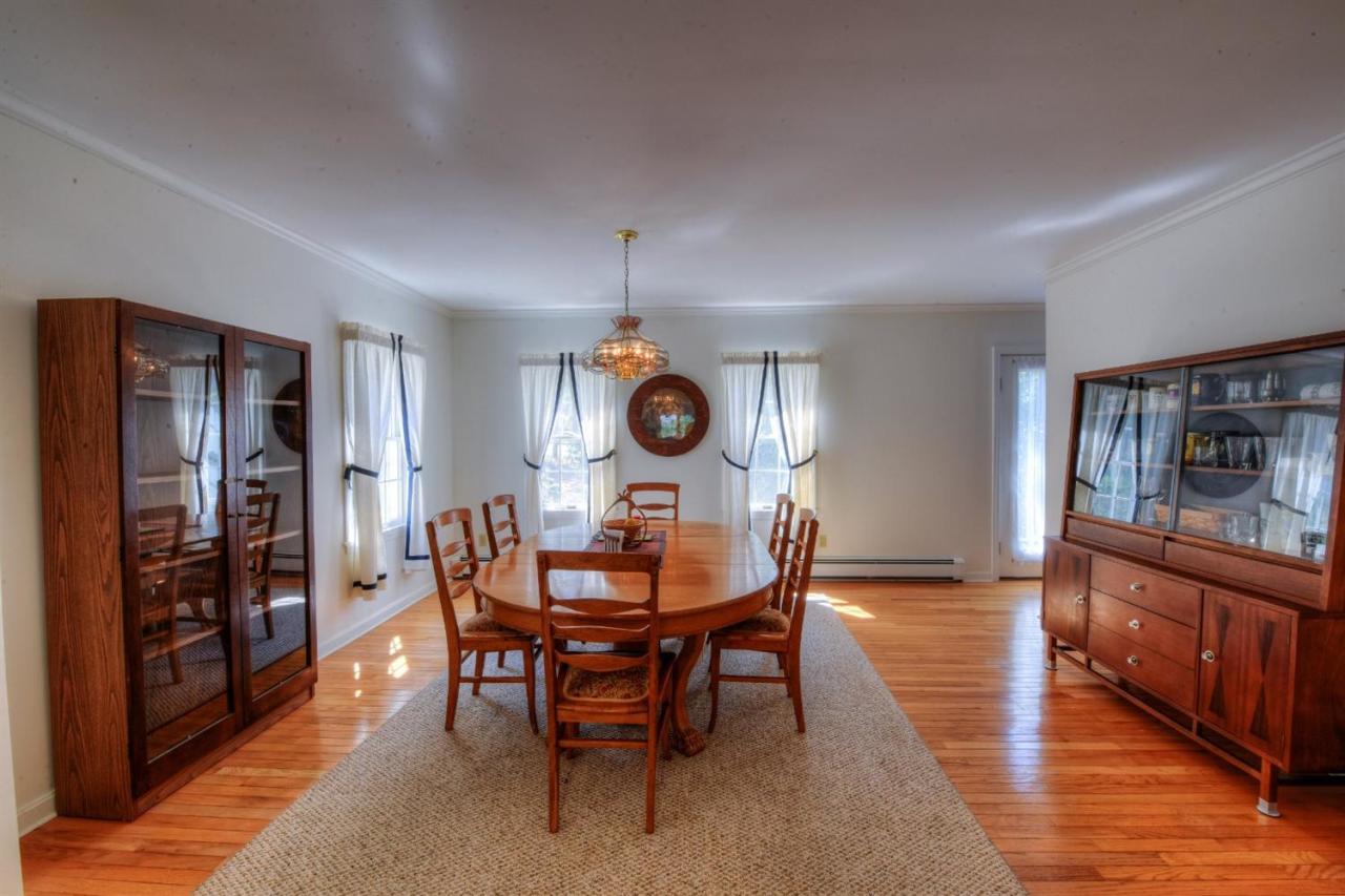 923 Old Post Road Cotuit, MA 02635 - Photo 16 of 35 a dining room with furniture and window