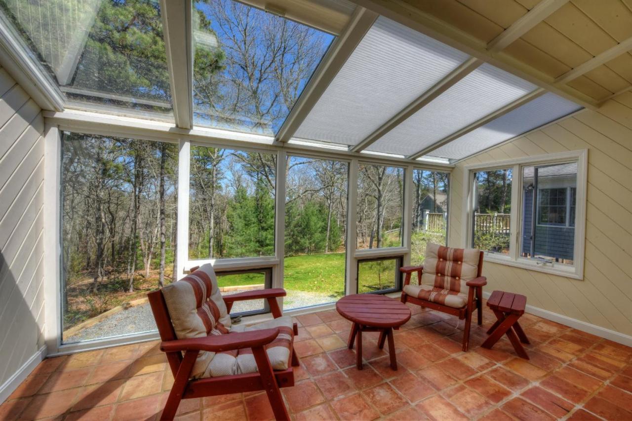 923 Old Post Road Cotuit, MA 02635 - Photo 21 of 35 a living room with furniture and a garden