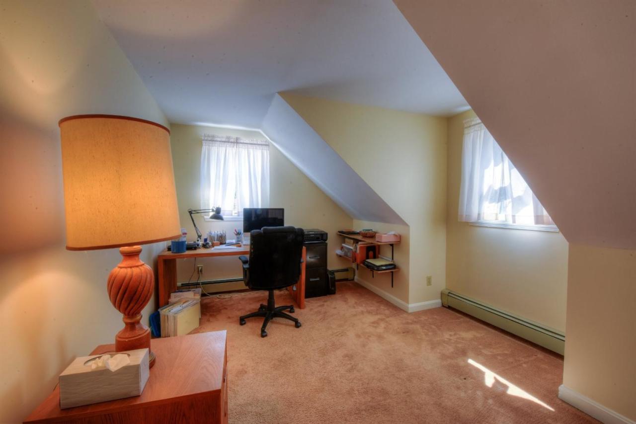 923 Old Post Road Cotuit, MA 02635 - Photo 25 of 35 a view of a workspace with furniture and a window