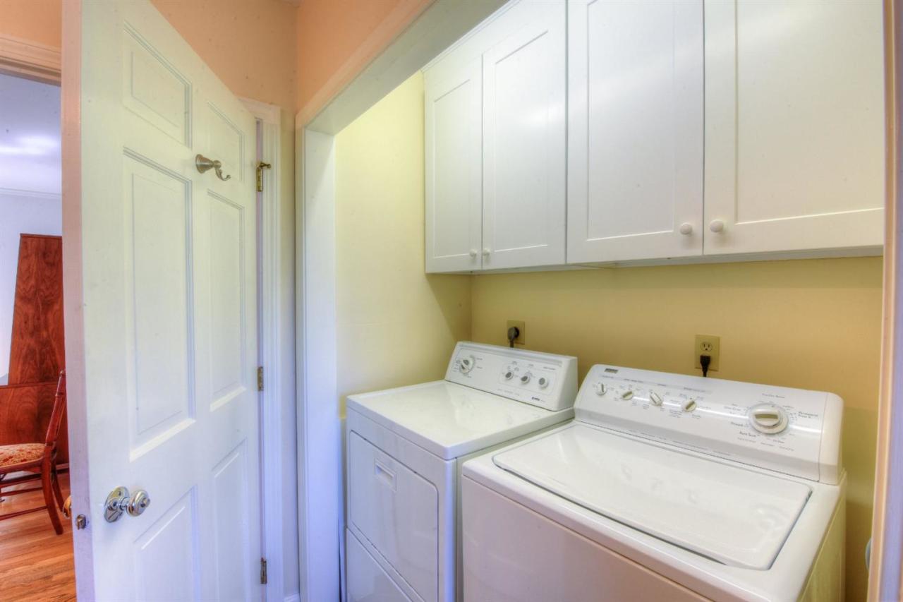 923 Old Post Road Cotuit, MA 02635 - Photo 9 of 35 a utility room with dryer and washer