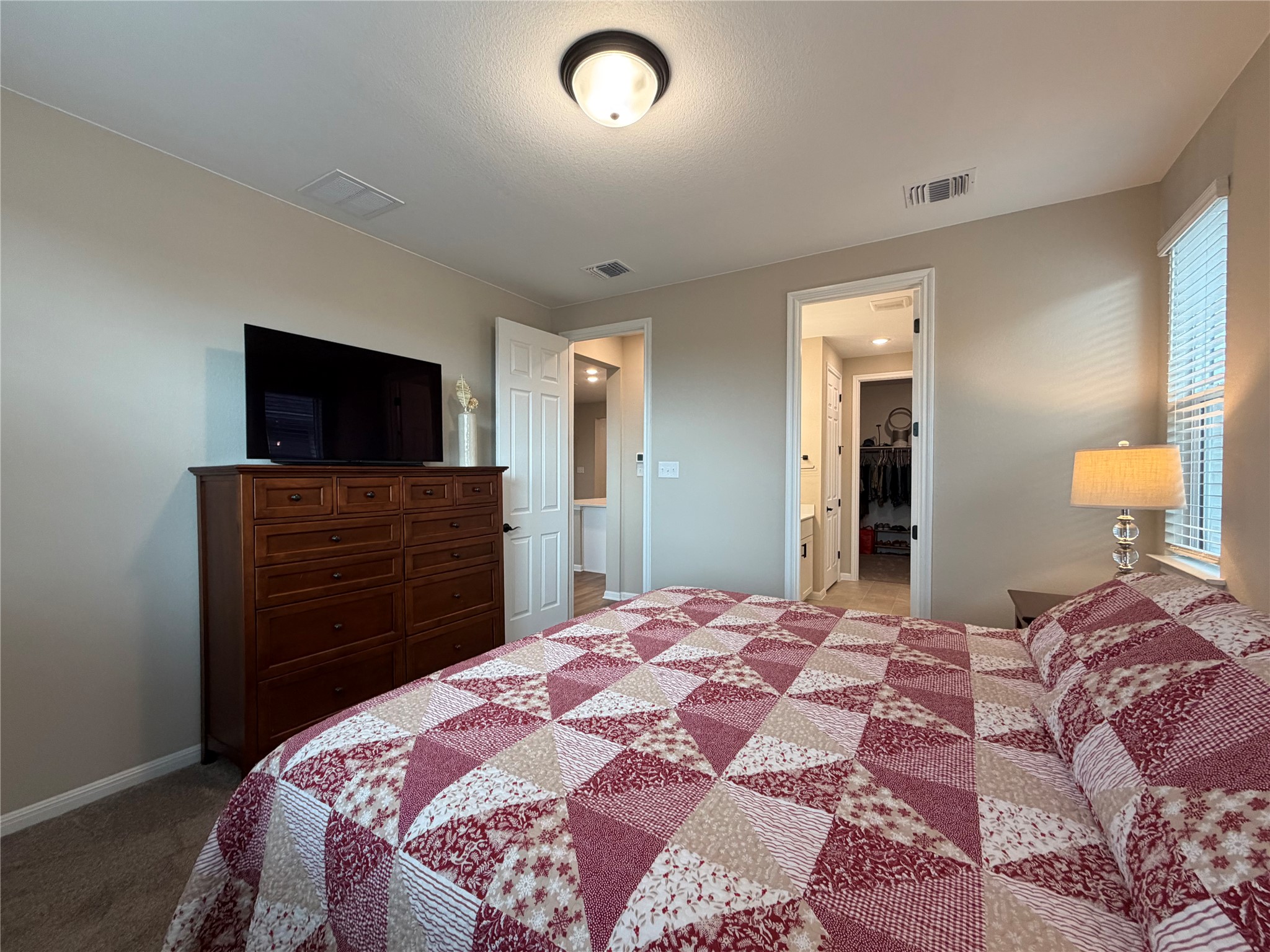 549 Raleigh Drive Georgetown, TX 78633 - Photo 19 of 29 a bedroom with a bed and a television