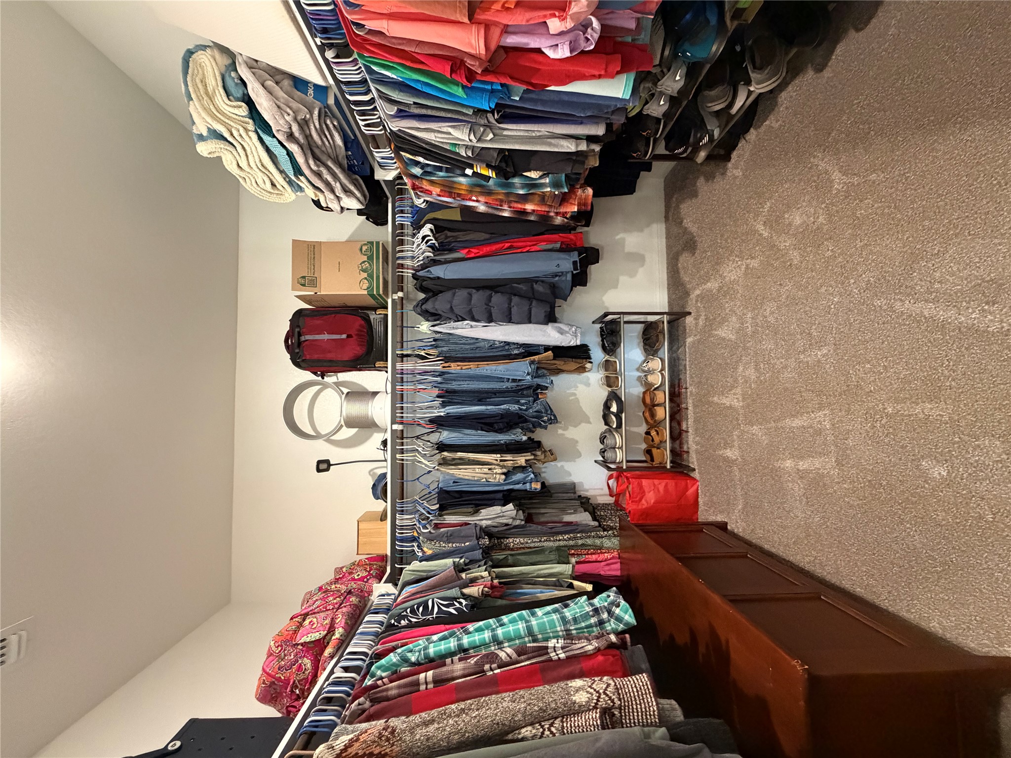 549 Raleigh Drive Georgetown, TX 78633 - Photo 22 of 29 a view of walk in closet with clothes
