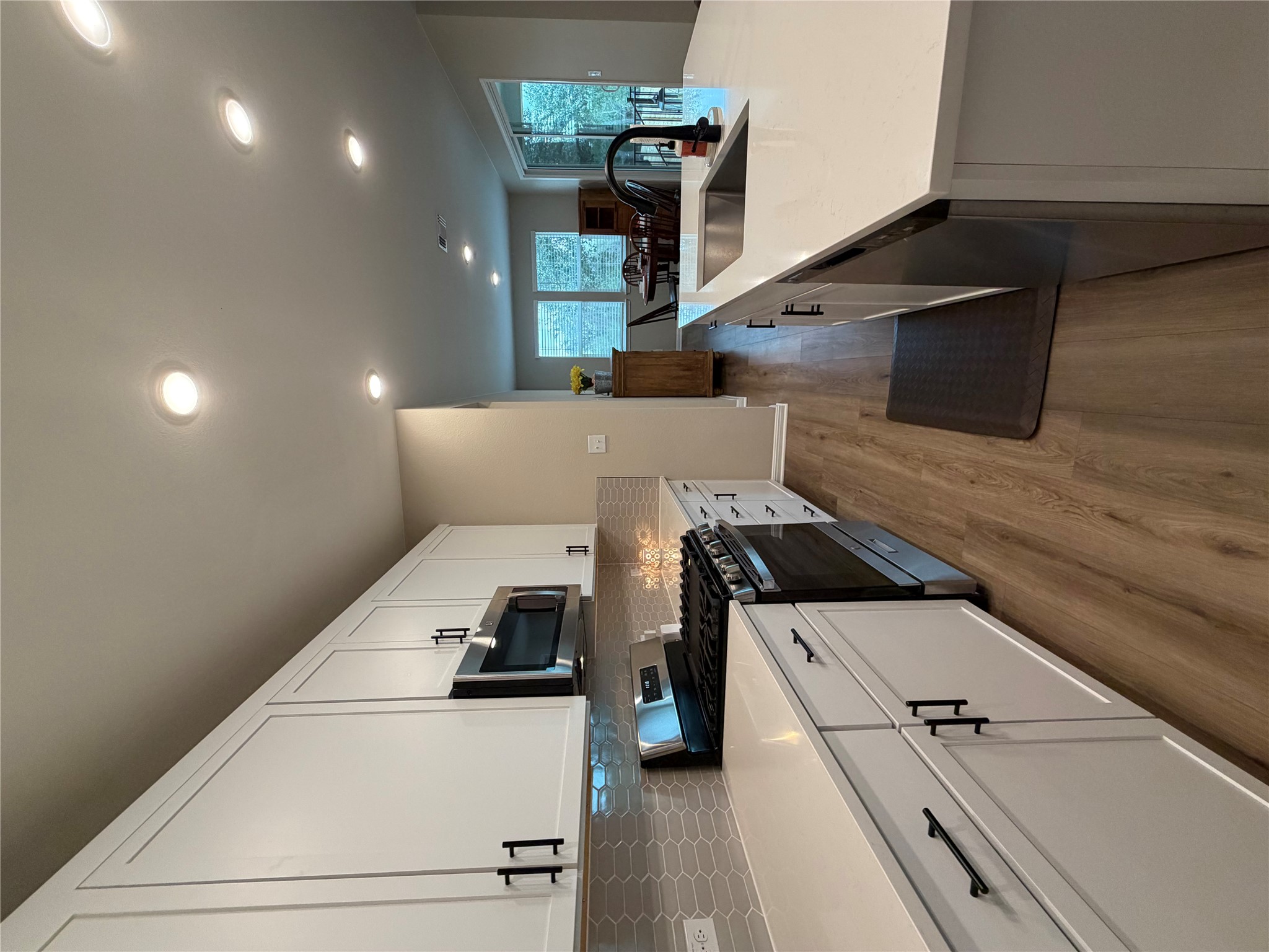 549 Raleigh Drive Georgetown, TX 78633 - Photo 26 of 29 a large kitchen with stainless steel appliances lots of counter space sink and cabinets