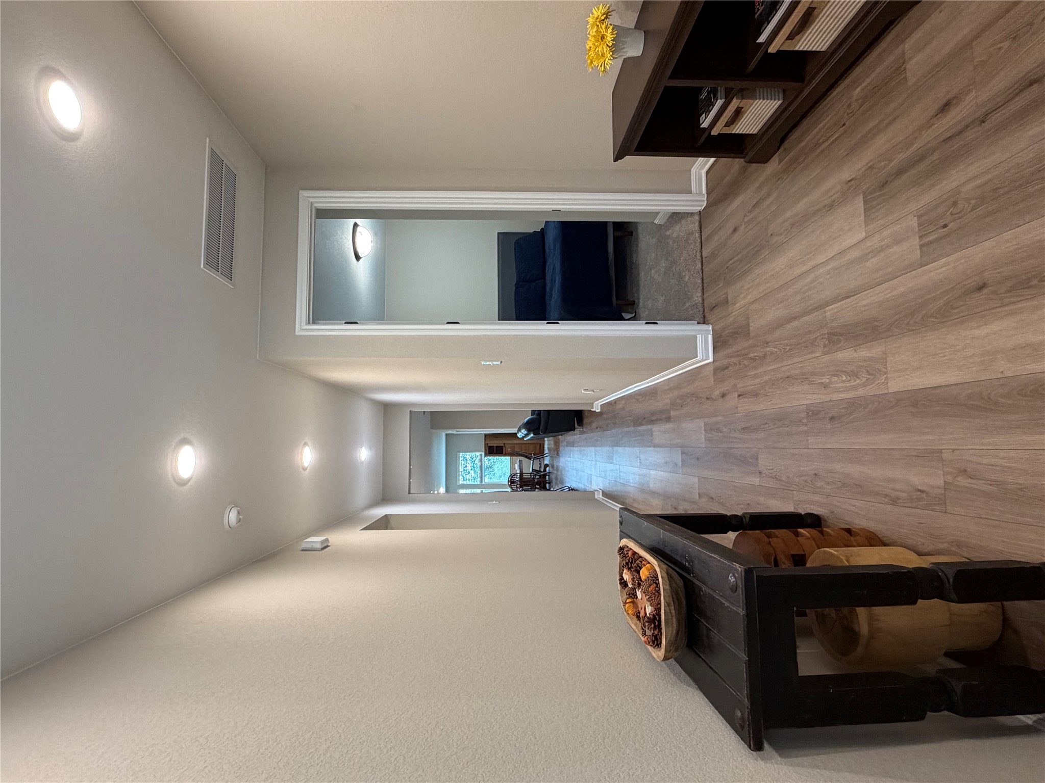 549 Raleigh Drive Georgetown, TX 78633 - Photo 5 of 29 a view of a hallway with wooden floor and furniture