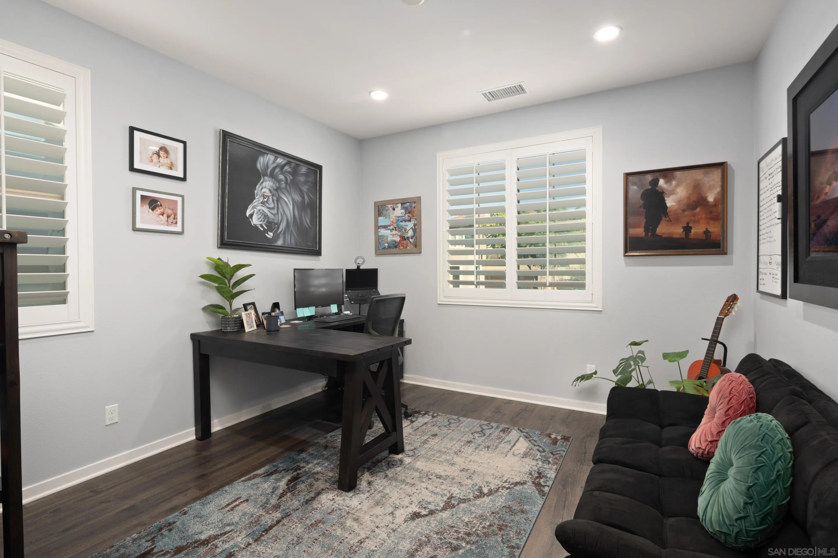 8932 Hightail Drive Santee, CA 92071 - Photo 14 of 20 a living room with furniture two windows and a flat screen tv