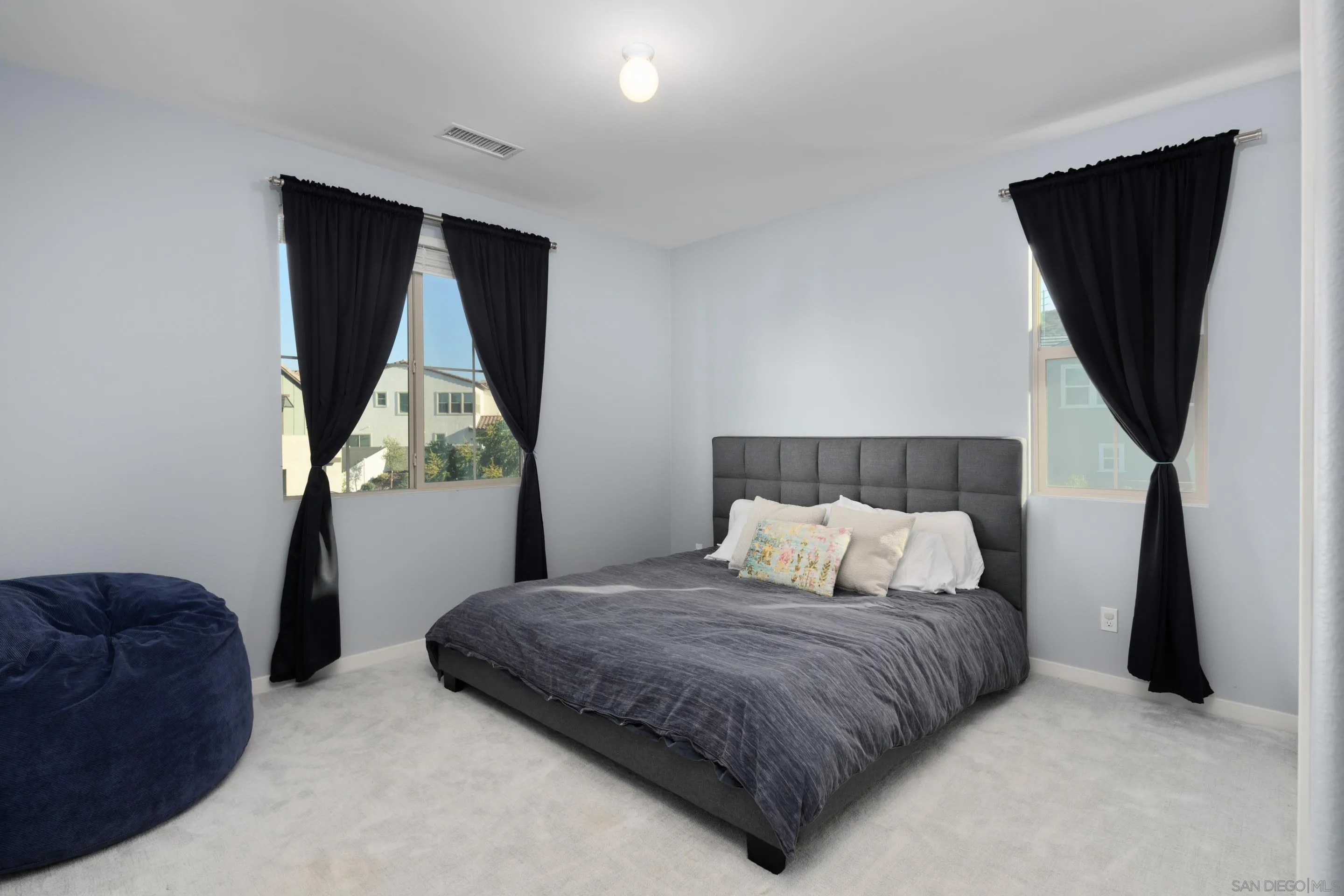 8932 Hightail Drive Santee, CA 92071 - Photo 16 of 20 a bedroom with a bed and a television