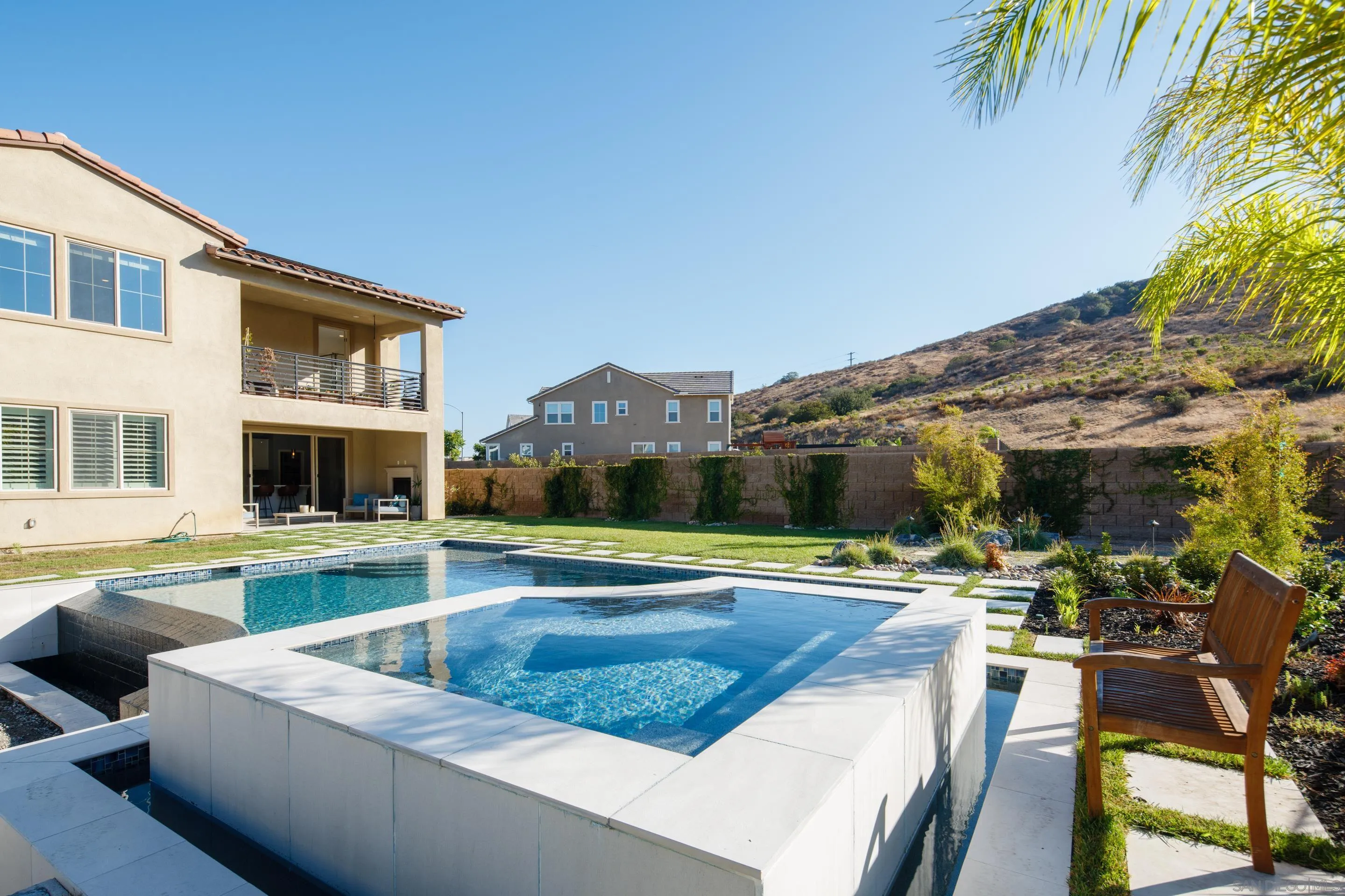 8932 Hightail Drive Santee, CA 92071 - Photo 18 of 20 a view of an house with swimming pool and chairs
